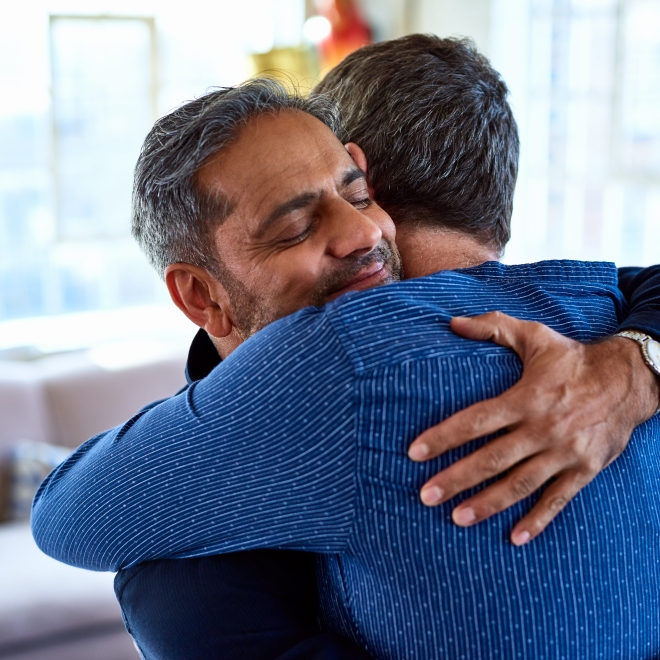 men hugging